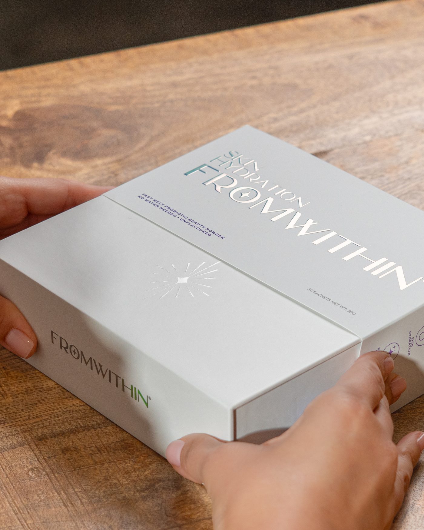 The FROMWITHIN box, foil lettering in close-up